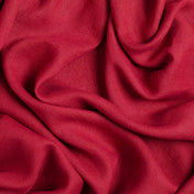 Burgundy linen fabric, crumpled to show its natural texture, washed European flax
