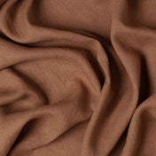 Cinnamon linen fabric, crumpled to show its natural texture, washed European flax
