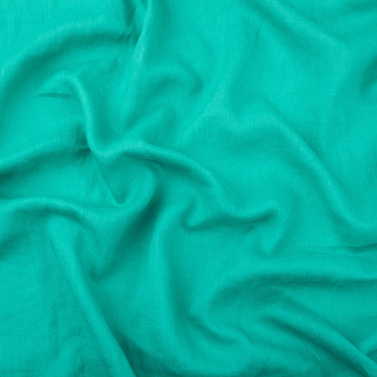 Aqua linen fabric, crumpled to show its natural texture, washed European flax