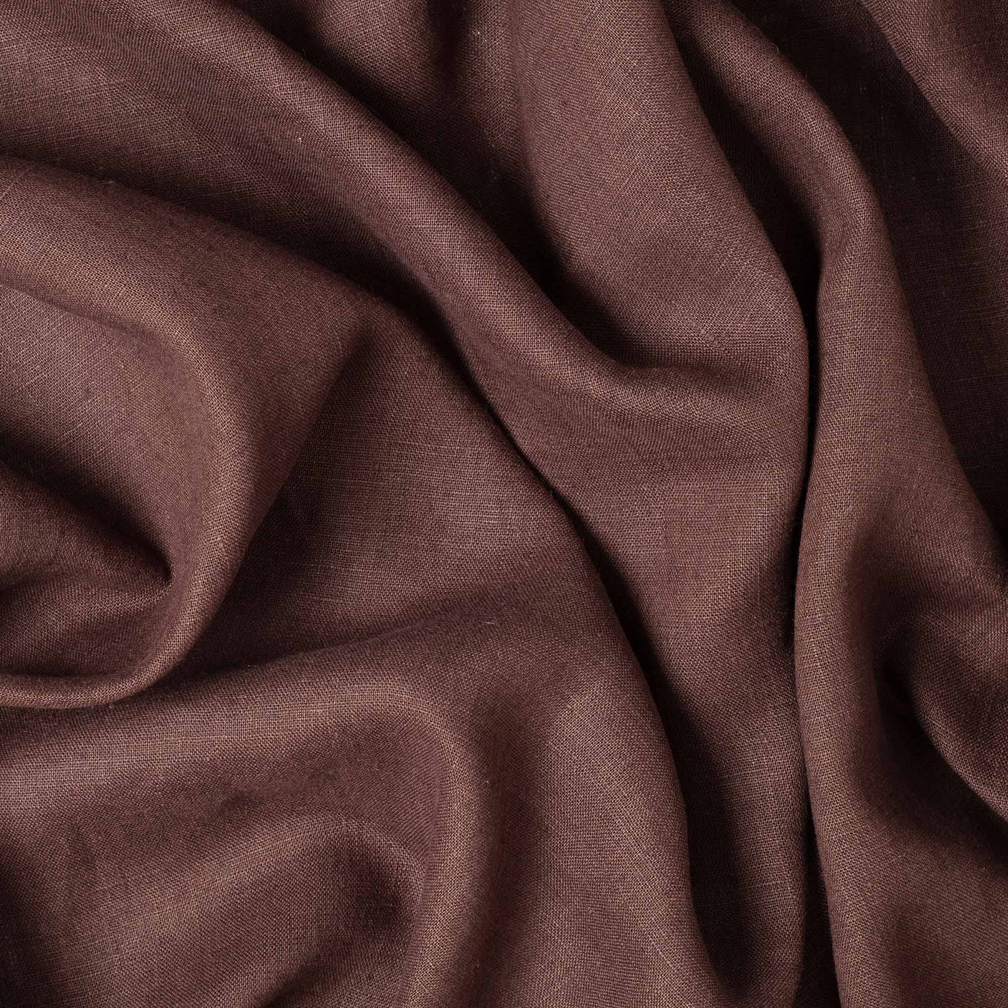 Dark Brown linen fabric, crumpled to show its natural texture, washed European flax