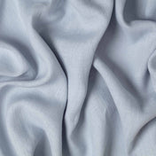 Dove Blue linen fabric, crumpled to show its natural texture, washed European flax
