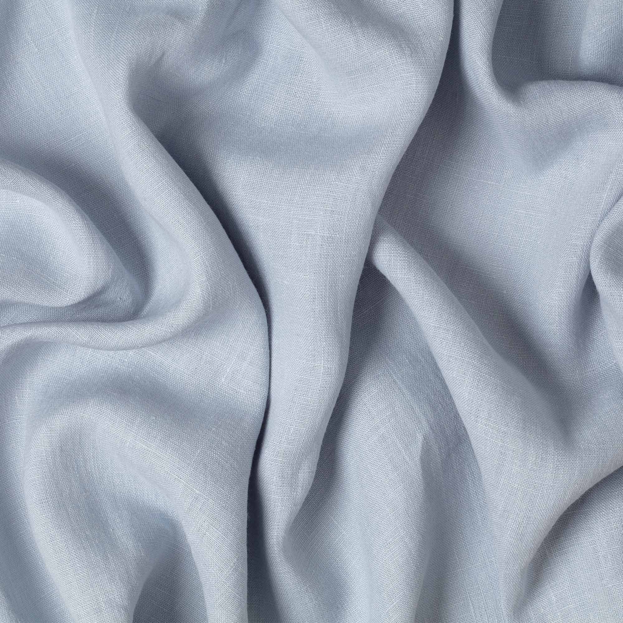 Dove Blue linen fabric, crumpled to show its natural texture, washed European flax