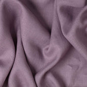 Dusty Purple linen fabric, crumpled to show its natural texture, washed European flax