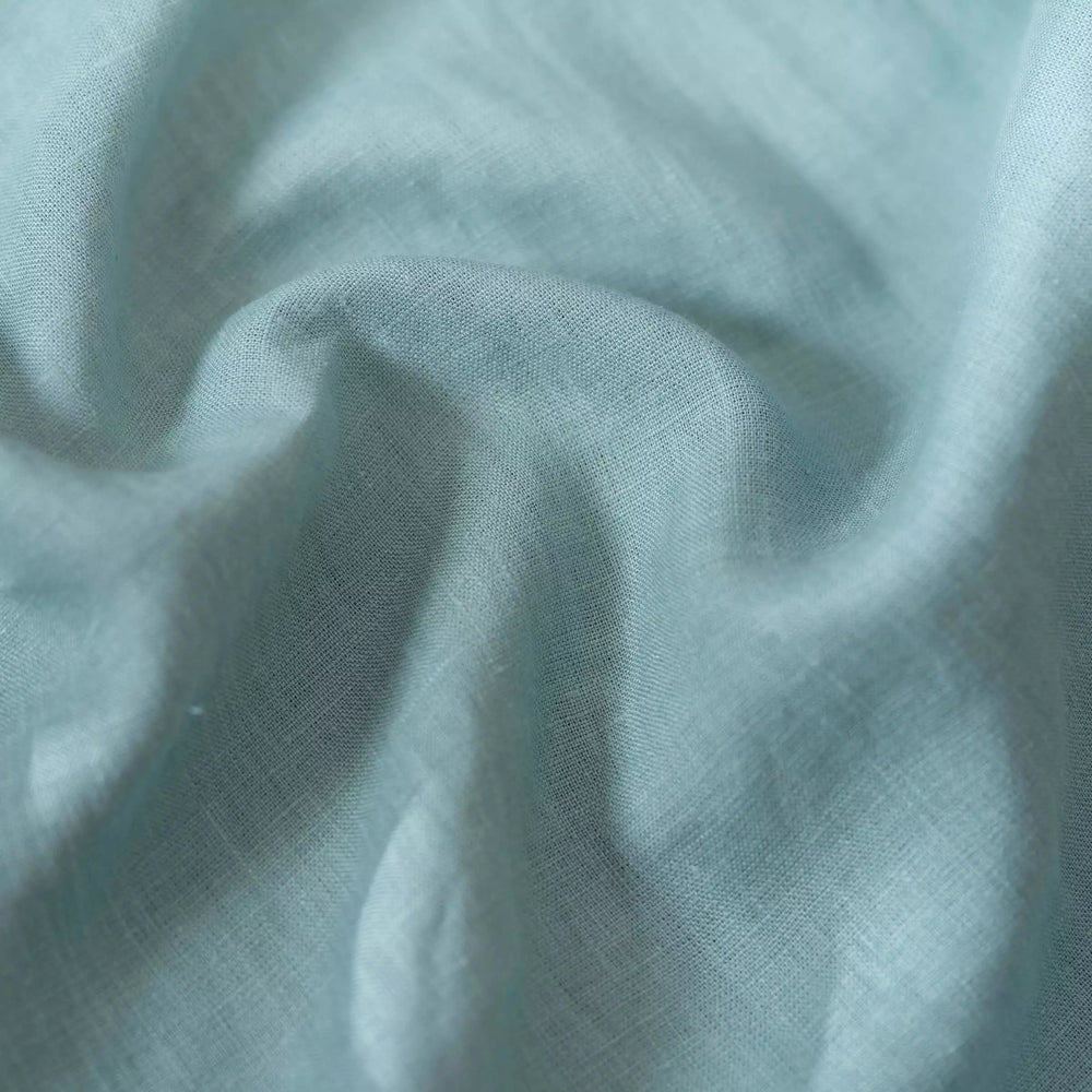 Dusty Turquoise linen fabric, crumpled to show its natural texture, washed European flax