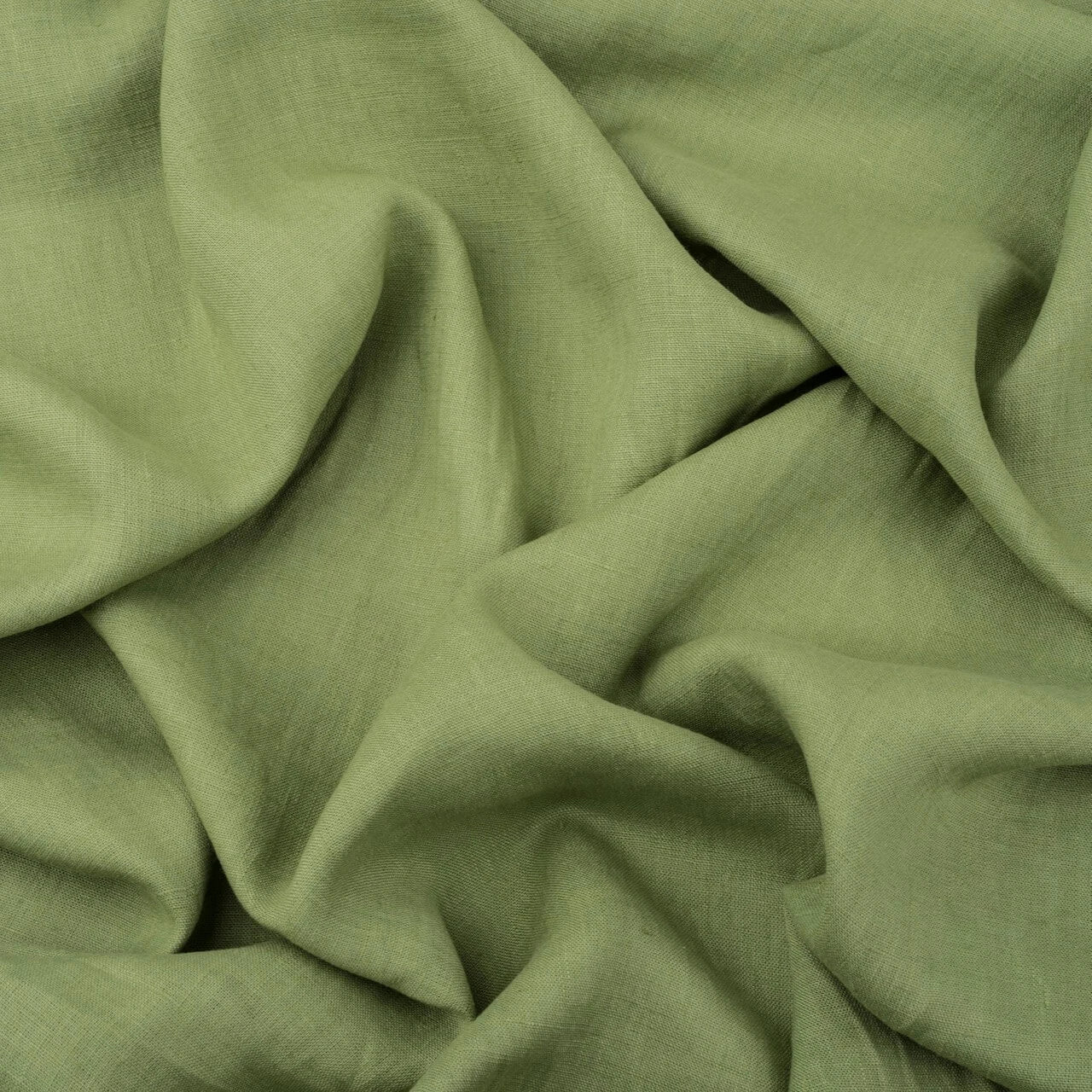 Fern Green linen fabric, crumpled to show its natural texture, washed European flax