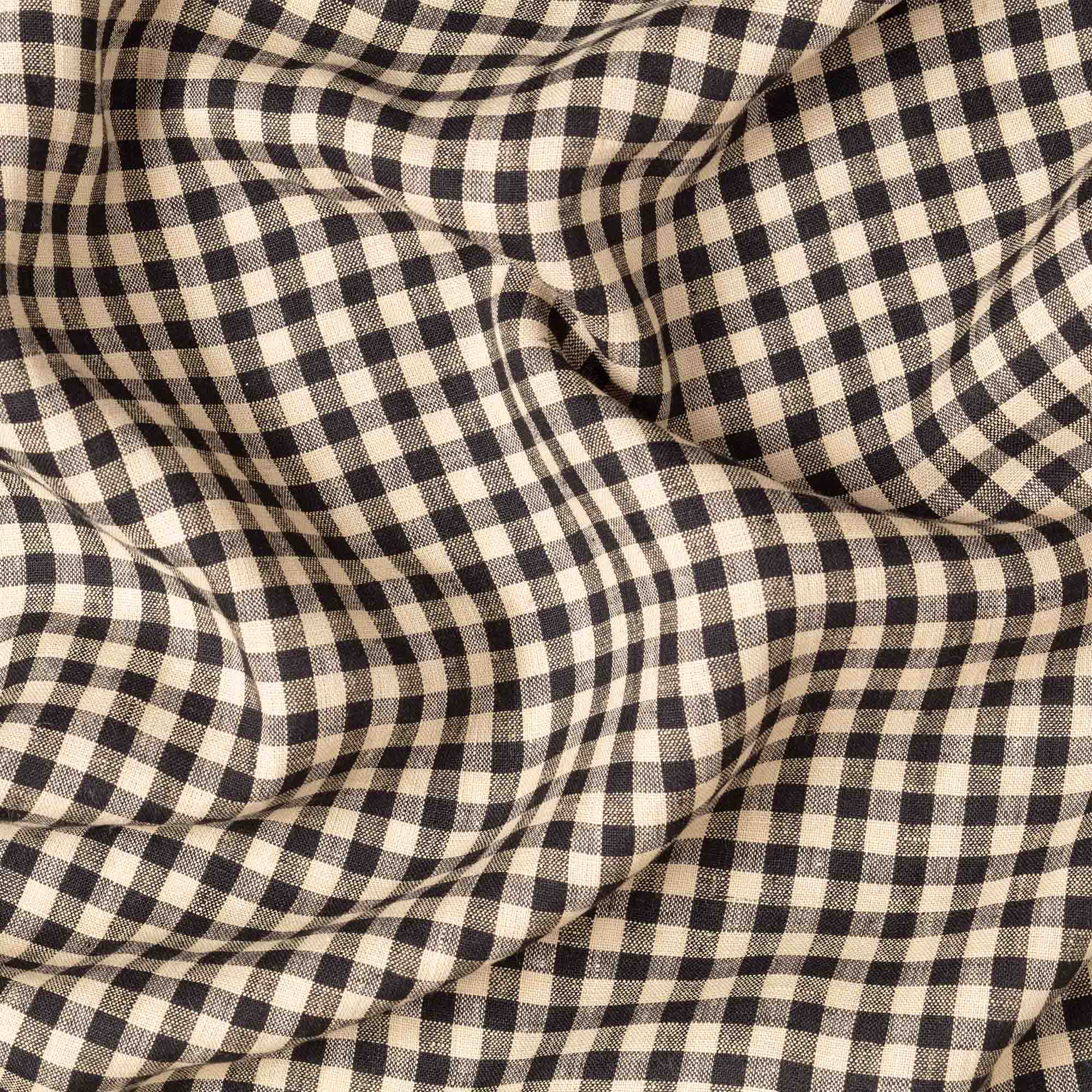 Fine Black & Natural Gingham linen fabric, crumpled to show its natural texture, washed European flax