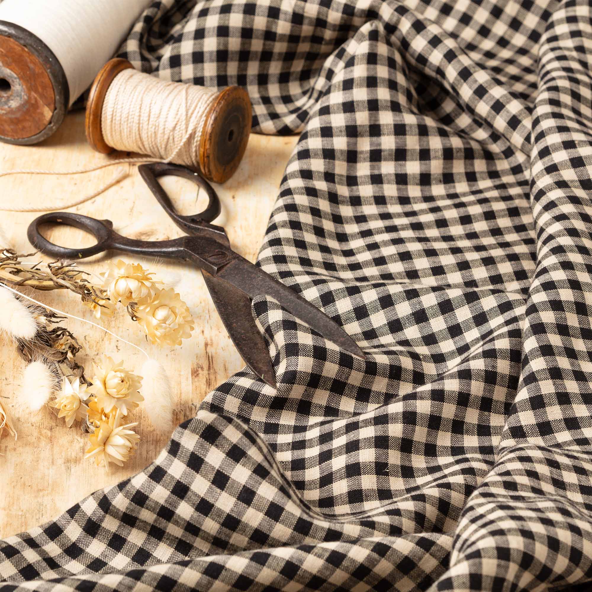 Fine Black & Natural Gingham linen fabric, ready to cut, with scissors, thread bobbins and flowers