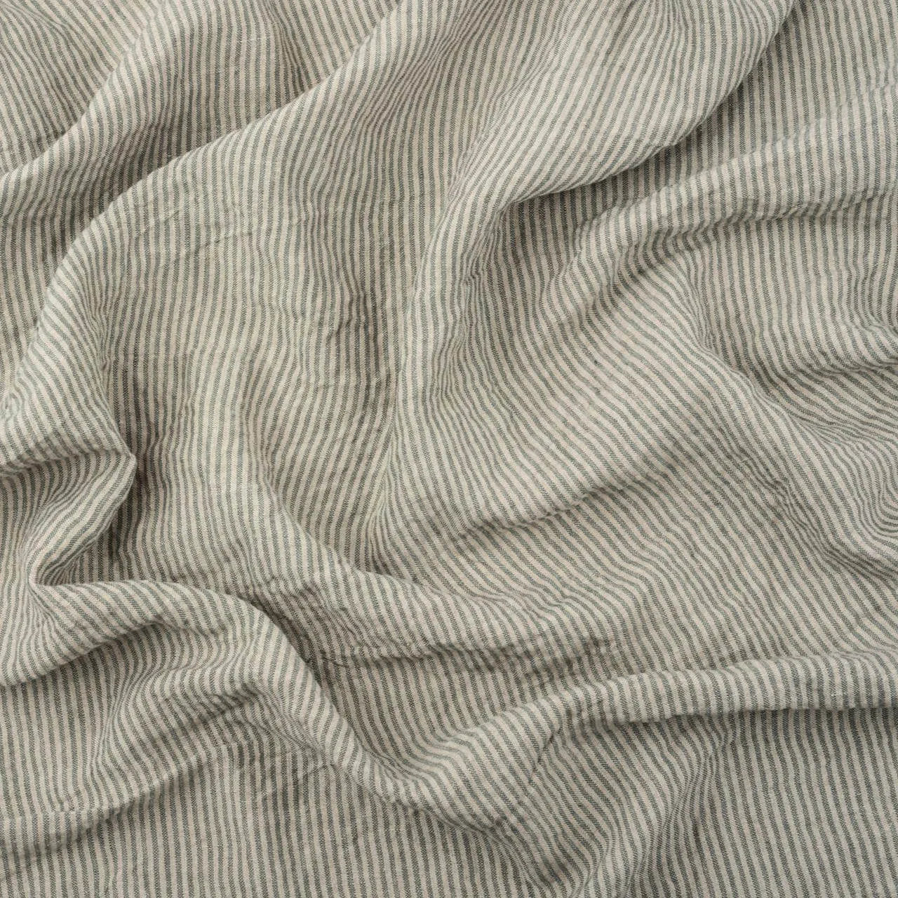 Greyish Green Stripes linen fabric, crumpled to show its natural texture, washed European flax