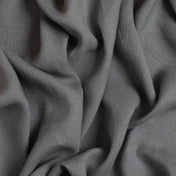 Grey linen fabric, crumpled to show its natural texture, washed European flax