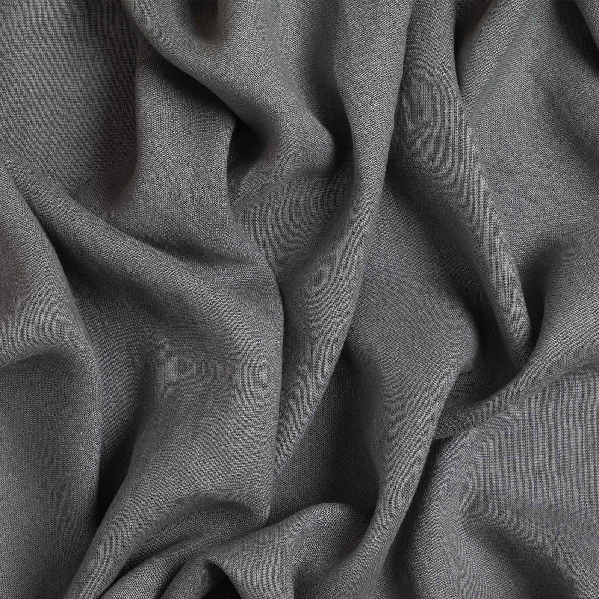 Grey linen fabric, crumpled to show its natural texture, washed European flax