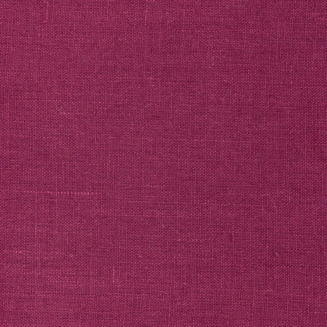 Magenta linen fabric, flat lay showing its natural weave, washed European flax