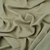 Light Sage Green linen fabric, crumpled to show its natural texture, washed European flax