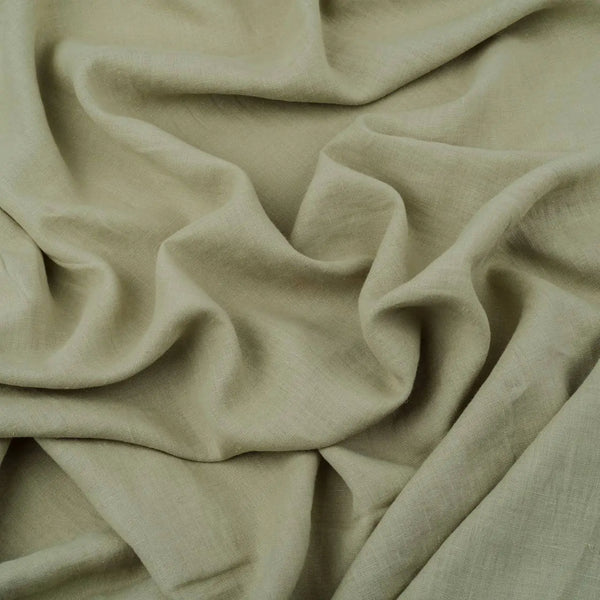 Light Sage Green linen fabric, crumpled to show its natural texture, washed European flax