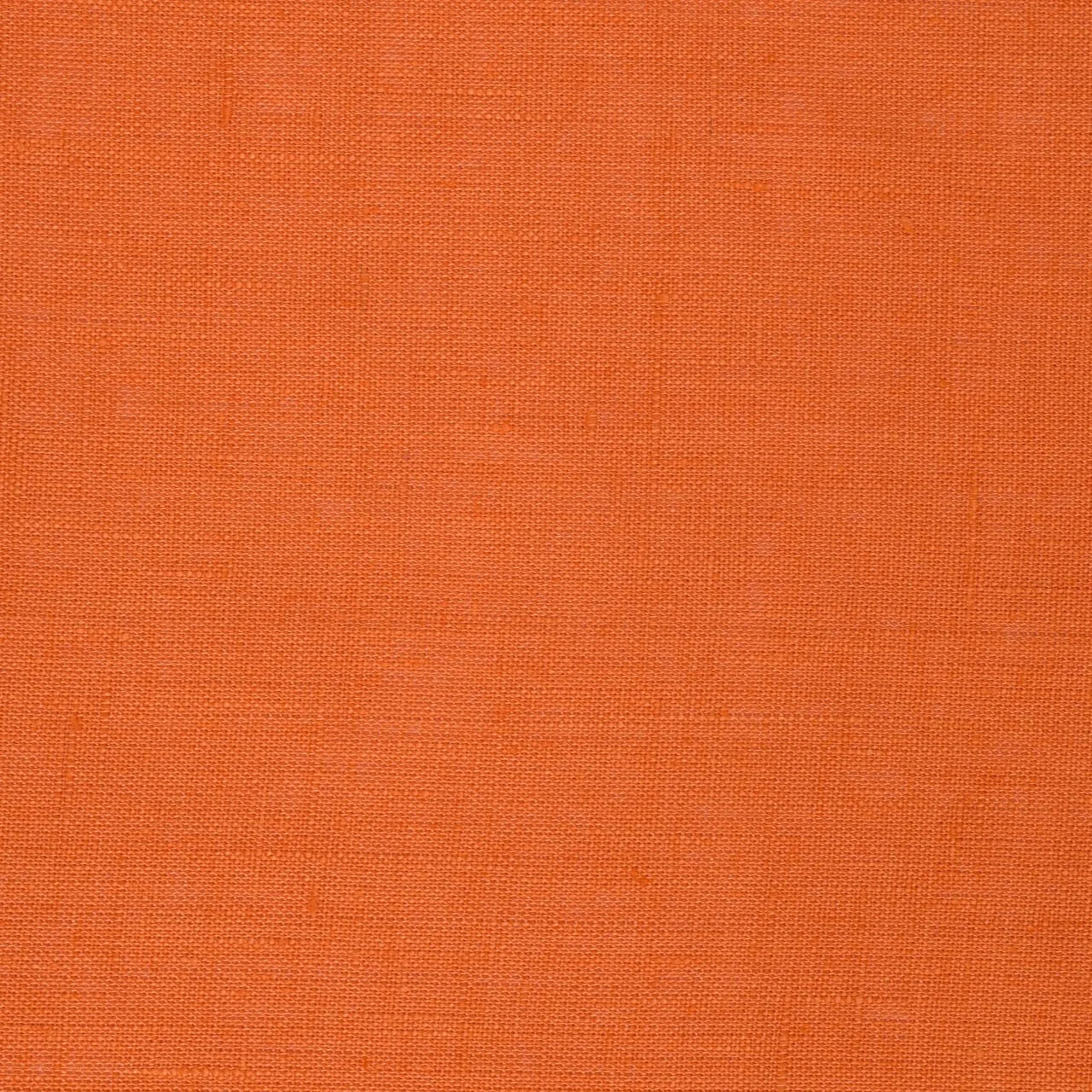 Tangerine linen fabric, flat lay showing its natural weave, washed European flax