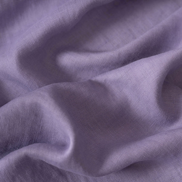Lavender linen fabric, crumpled to show its natural texture, washed European flax