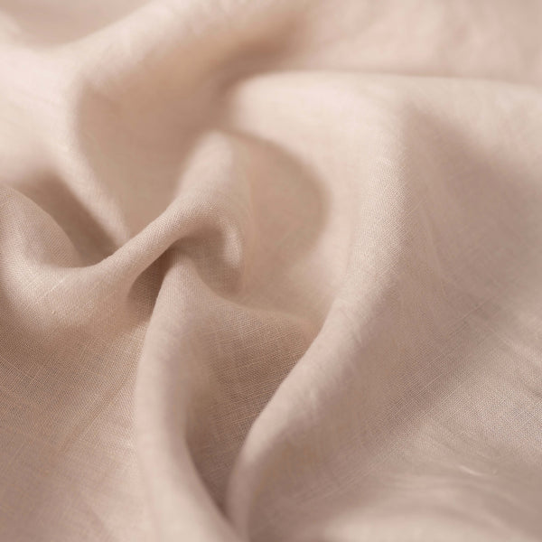 Oatmeal linen fabric, crumpled to show its natural texture, washed European flax